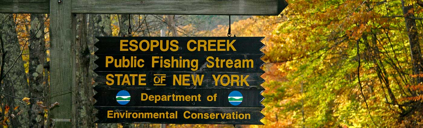 fishing access sign on stream